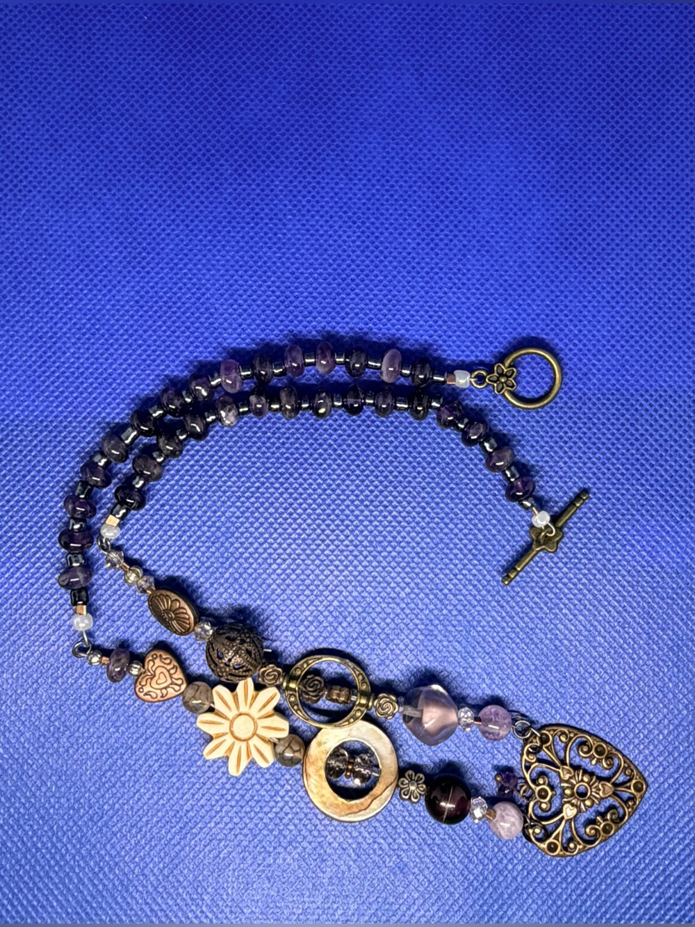 Handcrafted Purple Beaded Bracelet with Antique Gold Filigree Charm and heart